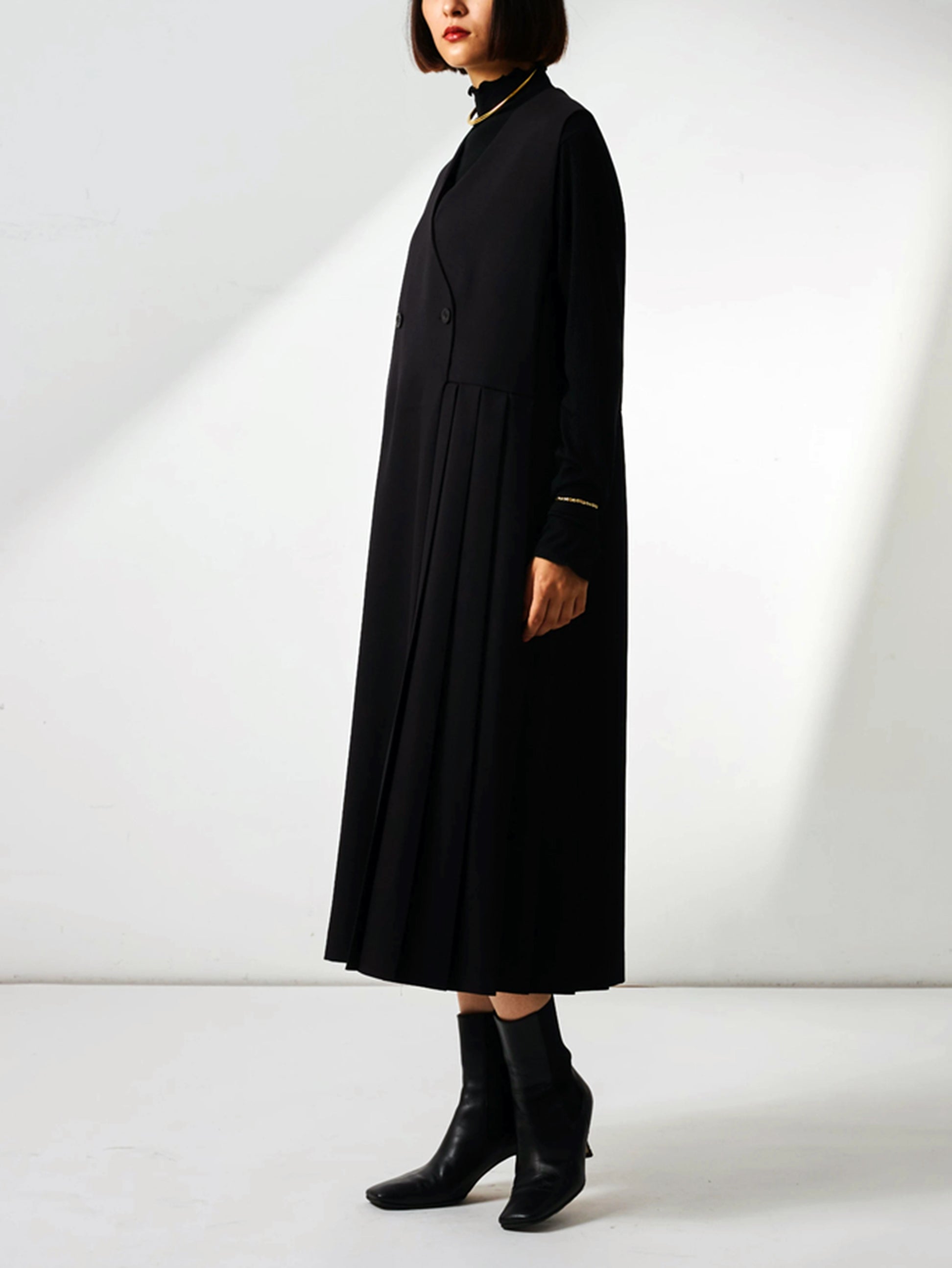 Asymmetrical pleated jumper skirt